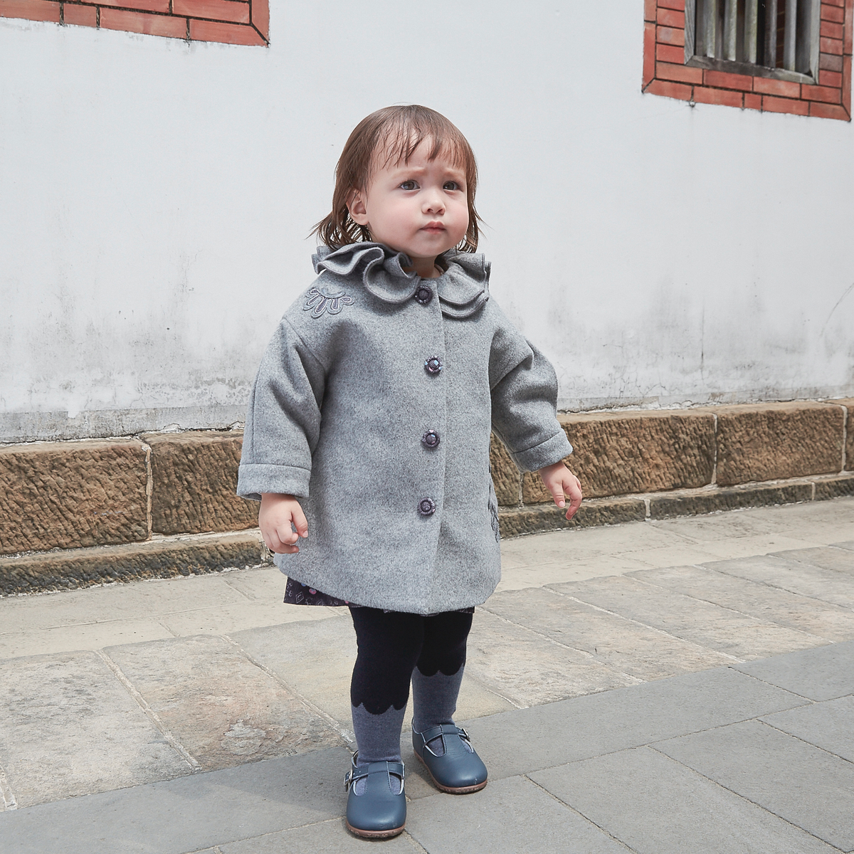 Heather grey baby coat with moonflower motif