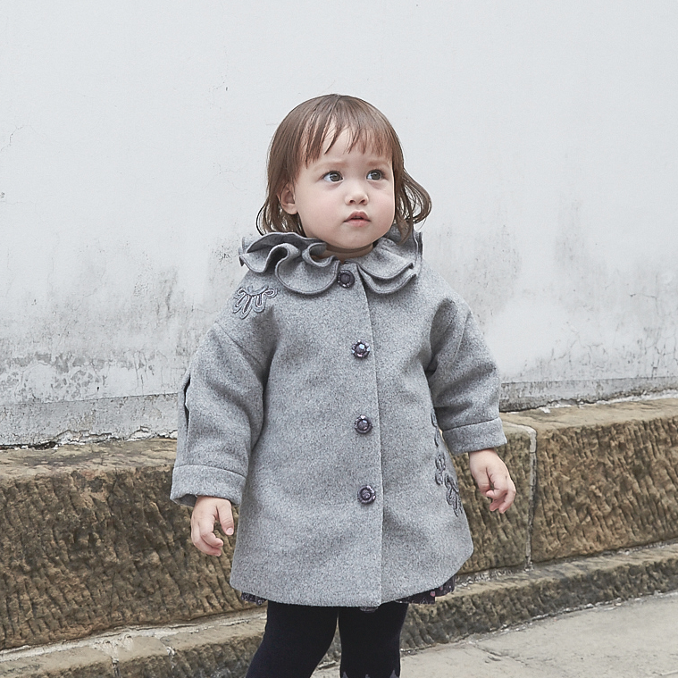 Heather grey baby coat with moonflower motif