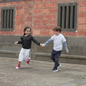 White kids hoodie with koi motif tattoo sleeves