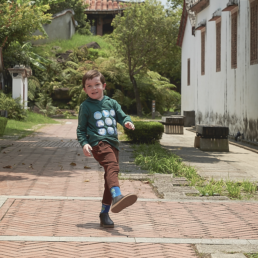 Dark brown kids trousers with good fortune and coin motif