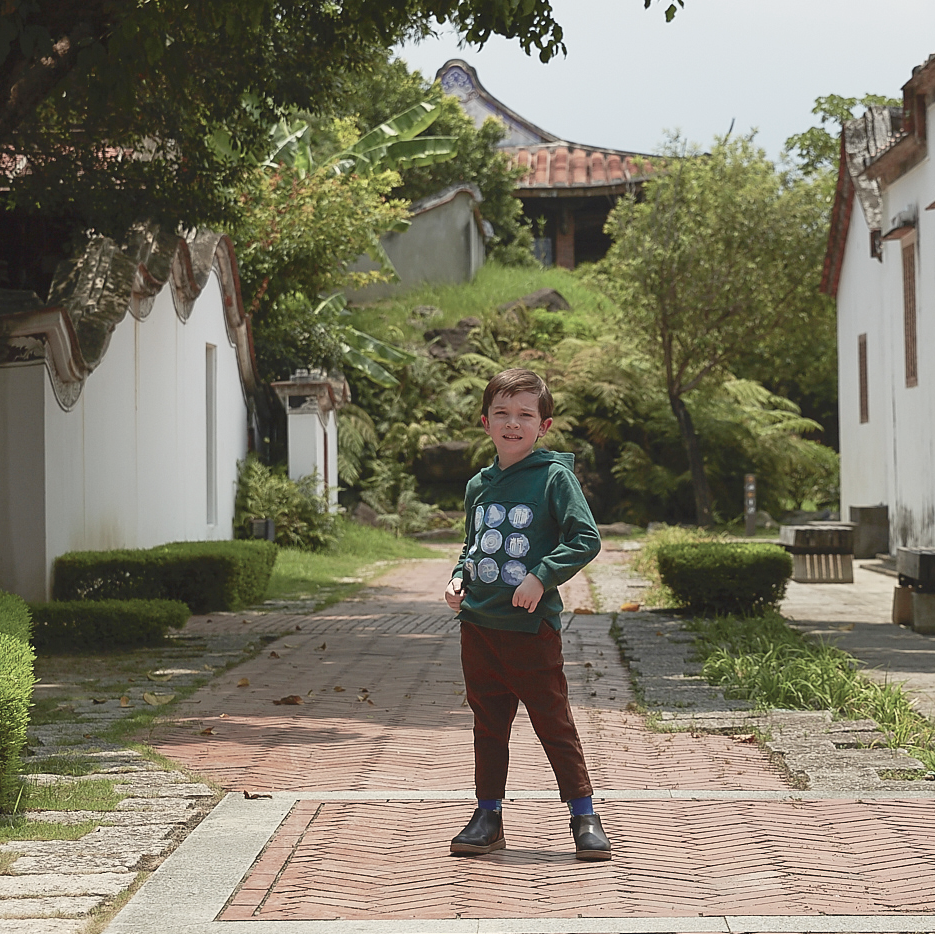 Dark brown kids trousers with good fortune and coin motif