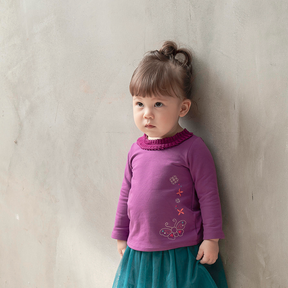 Purple long sleeve baby top with embroidered butterfly and coin motif