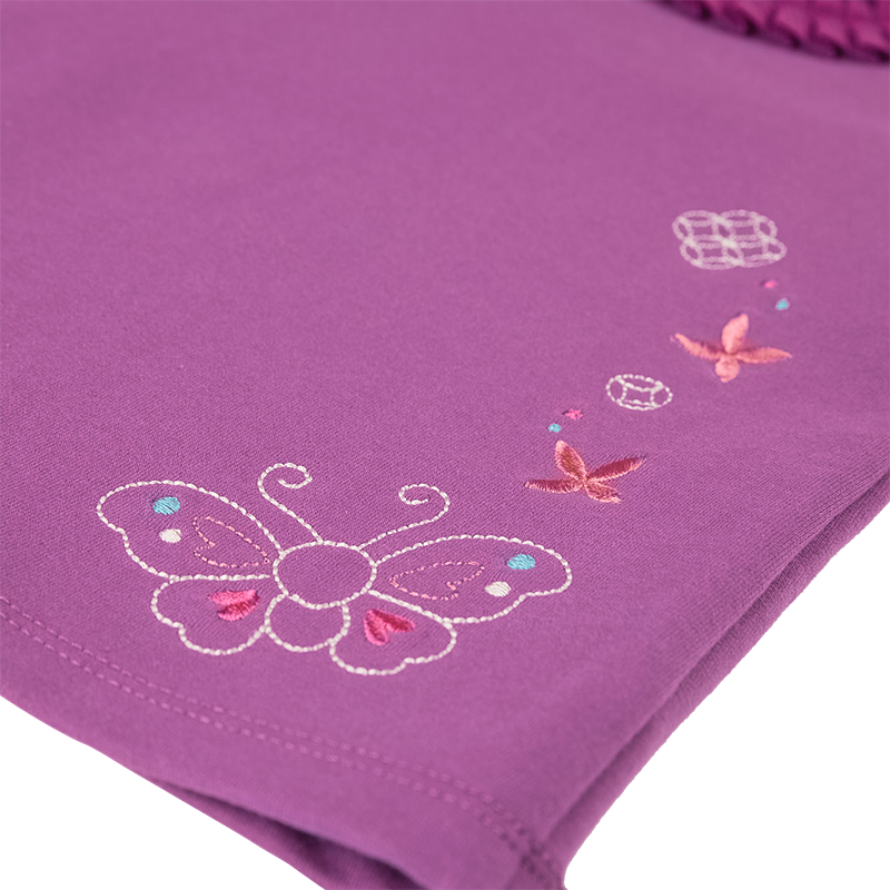 Purple long sleeve baby top with embroidered butterfly and coin motif