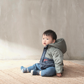 Khaki green baby coat with equestrian motif