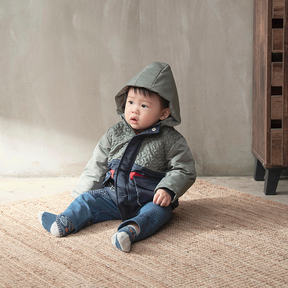 Khaki green baby coat with equestrian motif