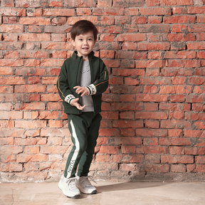 Dark green kids trousers with YUAN logo ribbons