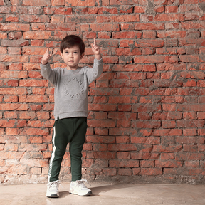 Dark green kids trousers with YUAN logo ribbons