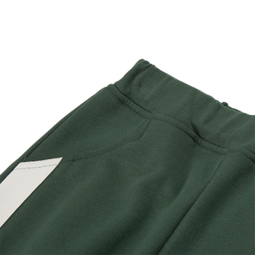 Dark green kids trousers with YUAN logo ribbons