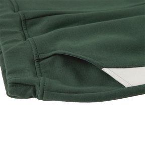 Dark green kids trousers with YUAN logo ribbons