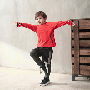 Black kids trousers with geometric designs