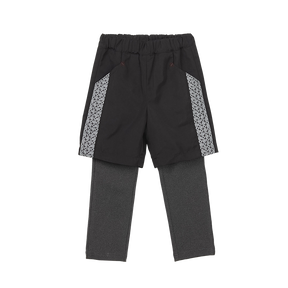 Black kids trousers with geometric designs