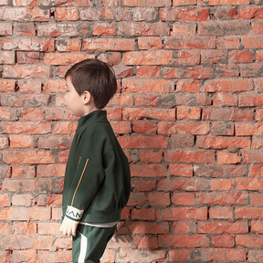 Dark green kids jacket with geometric designs