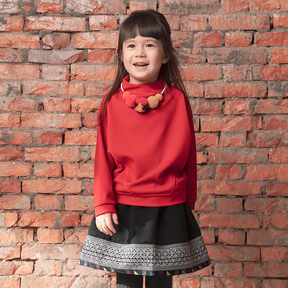 Black kids skirt with geometric designs and matching stockings