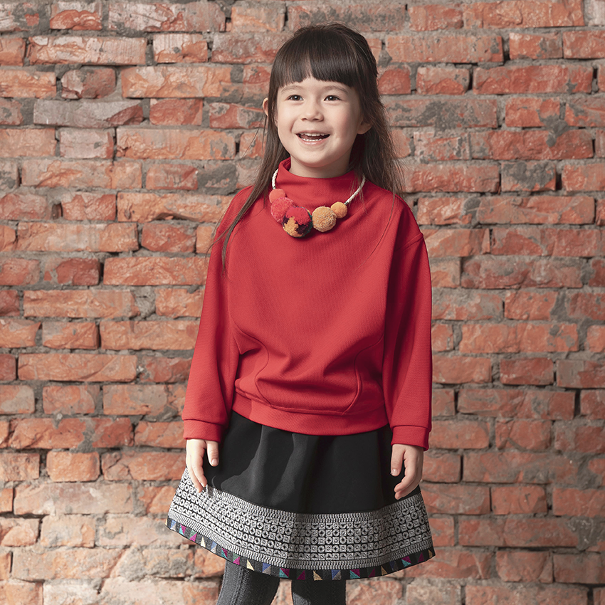 Red kids top with pom pom necklace