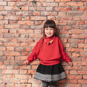 Red kids top with pom pom necklace