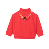 Red kids top with pom pom necklace