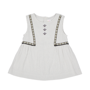 <tc>Ivory kids sleeveless top with tassels</tc>