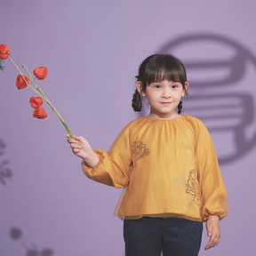 Mustard kids bubble top with gauze overlay and peony motif