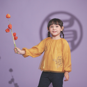 Mustard kids bubble top with gauze overlay and peony motif