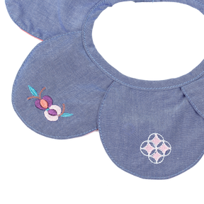 Blue petal shaped baby bib with embroidered pomegranates