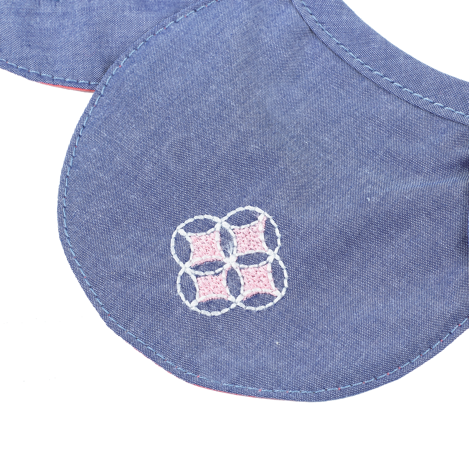 Blue petal shaped baby bib with embroidered pomegranates