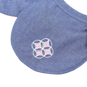 Blue petal shaped baby bib with embroidered pomegranates