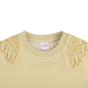 Lime green baby top with wing motif